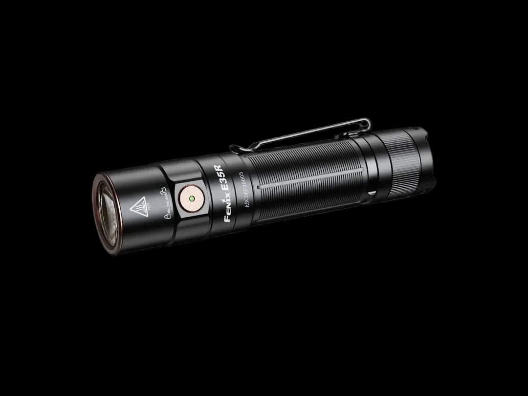 A black Fenix E35F tactical flashlight with a metal clip, shown diagonally on a light gray background. #Black_01