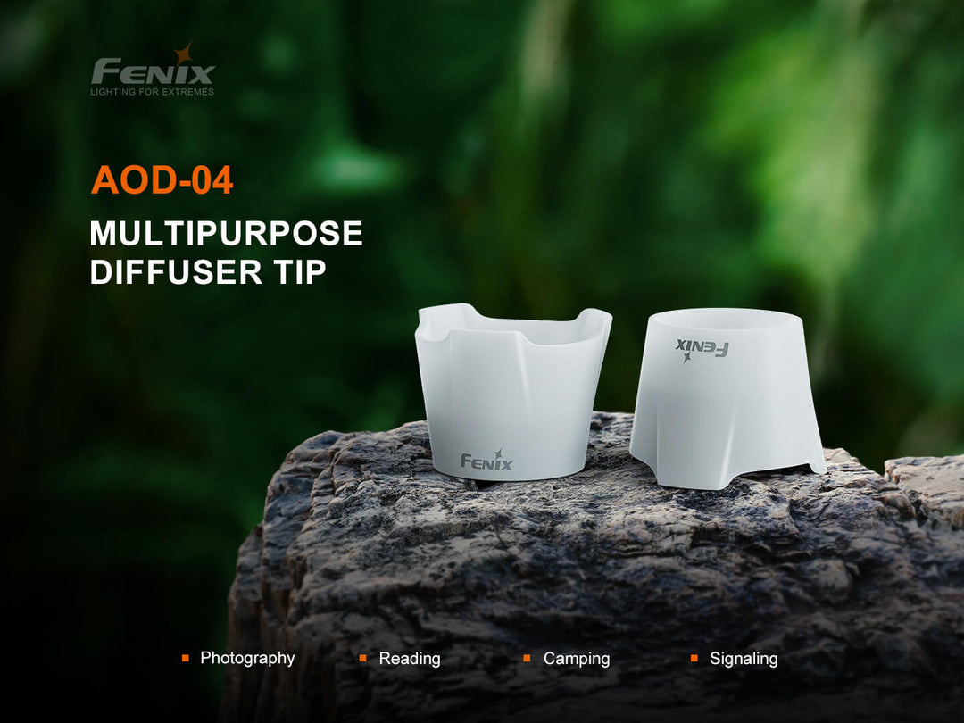 Fenix AOD-04 multipurpose diffuser tip on a rock with a blurred green background
