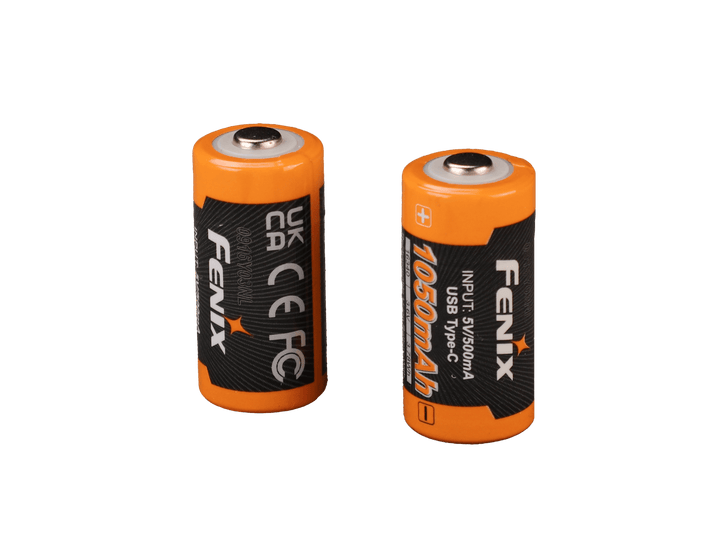 Two orange Fenix ARB-L16-1050UP USB Rechargeable 16340 batteries with black labels on a black background