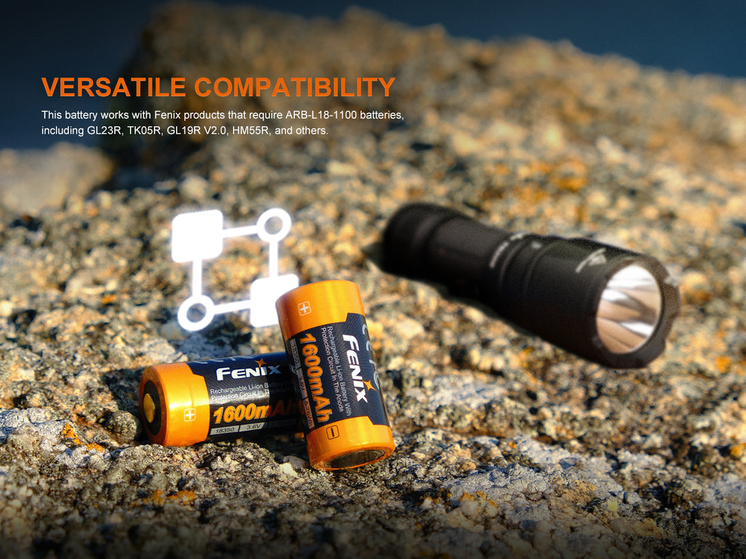 Fenix ARB-L18-1600 18350 rechargeable battery with a flashlight on stone