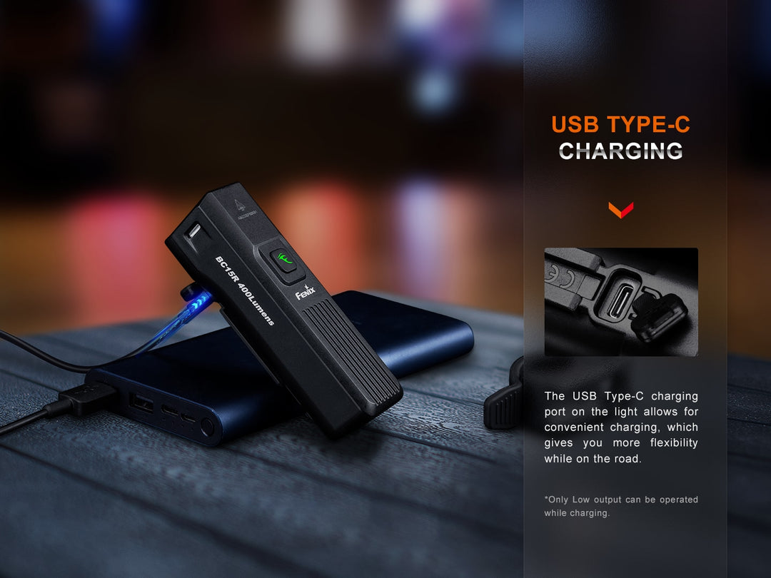 Fenix BC15R Bike Light on a table being charged by a powerbank