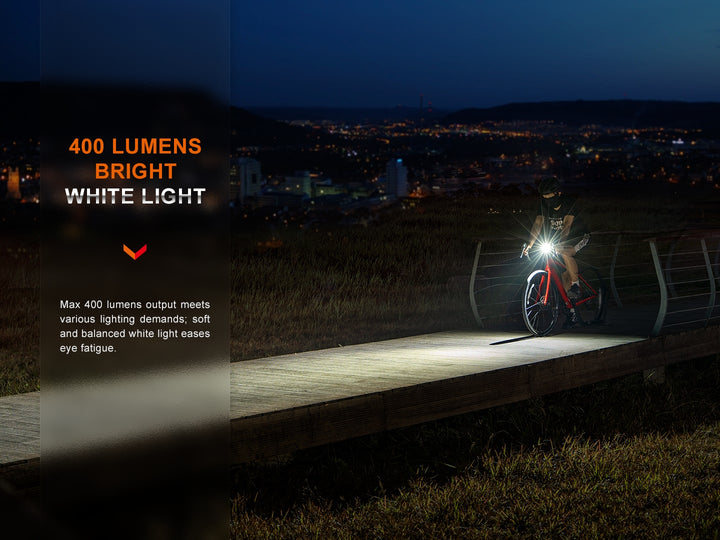 A cyclist riding on a pier while using the Fenix BC15R Bike Light 