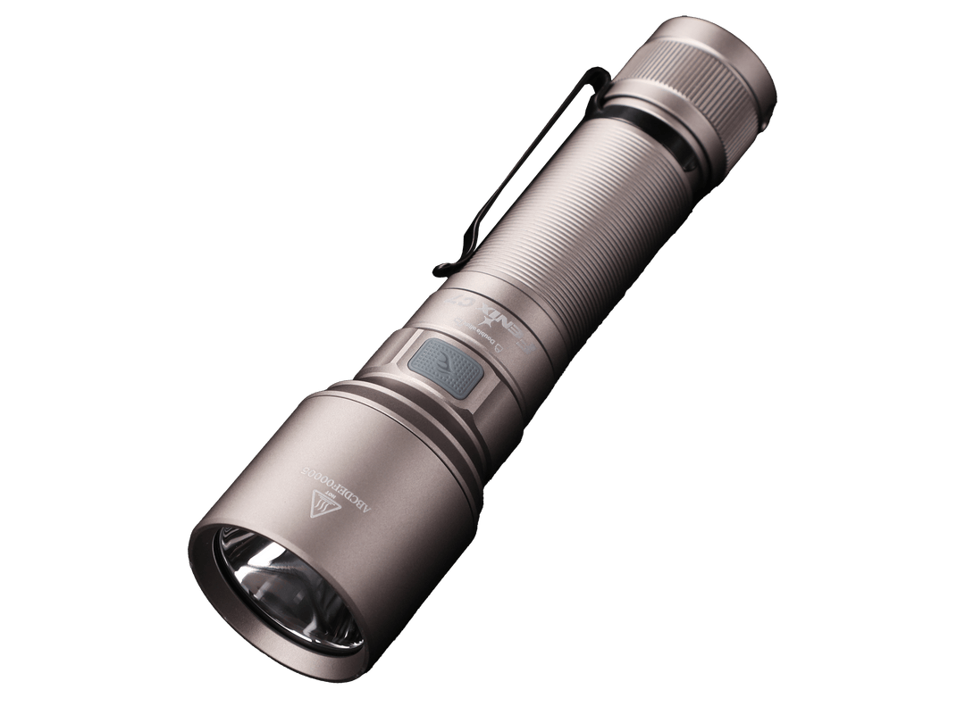 Silver Fenix C7 rechargeable LED flashlight on a black background