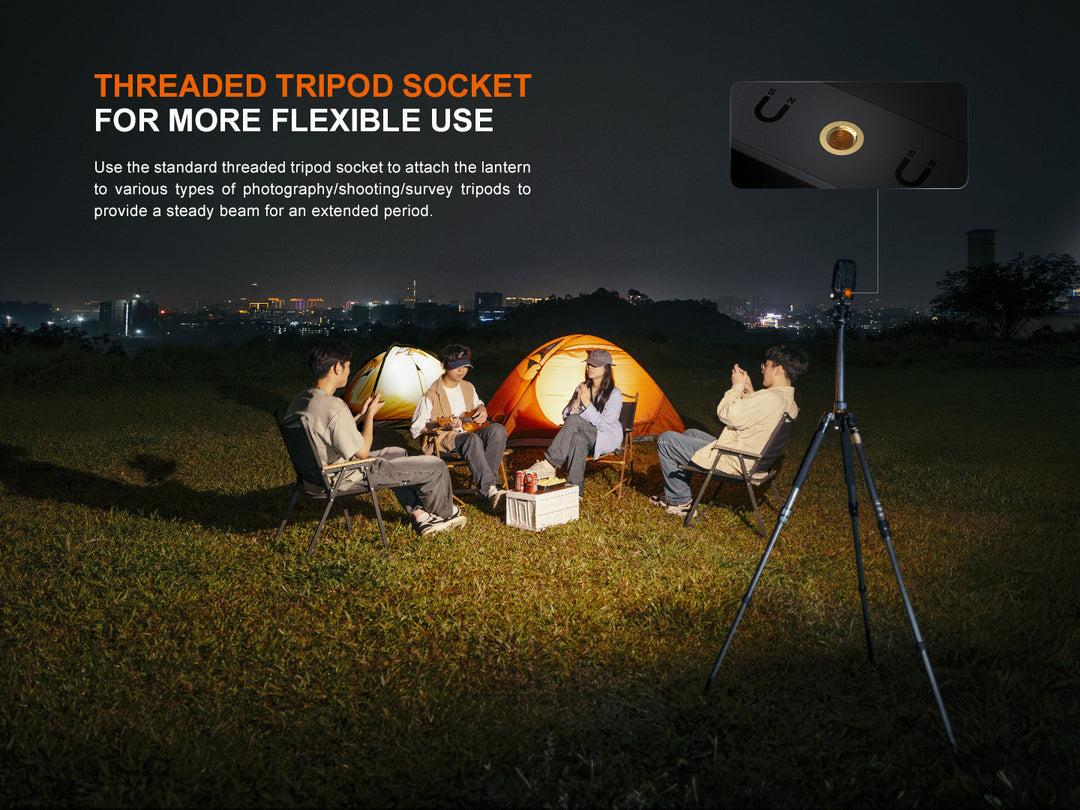 Fenix CL27R multifunctional outdoor lantern used on a tripod to light up a group of campers