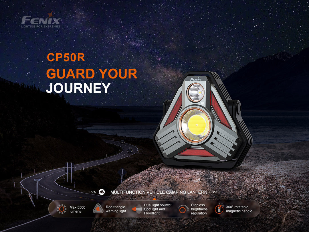 Fenix CP50R lantern on a rock with a night sky and road in the background