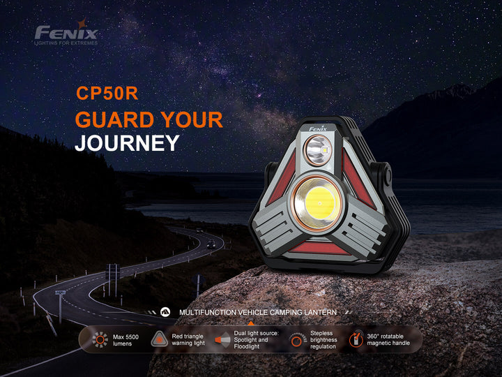 Fenix CP50R lantern on a rock with a night sky and road in the background