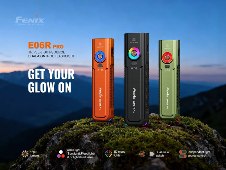 Three Fenix E06R Pro flashlights in orange, black, and green on a mountain background with text about the flashlight features.