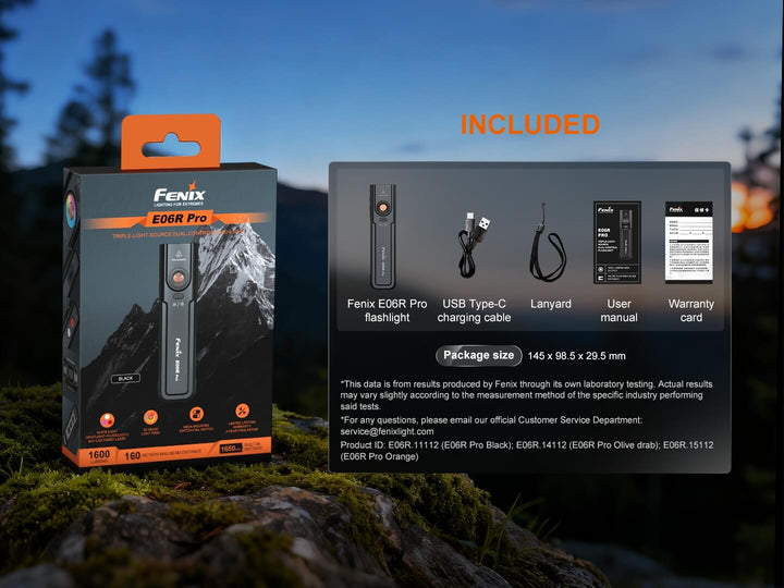 Fenix E06R Pro flashlight packaging with included items list against a natural background