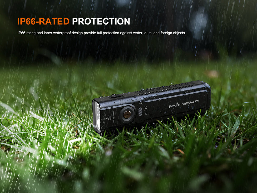 Black Fenix E06R Pro RG Green Laser Flashlight on grass with raindrops and 'IP66-Rated Protection' text