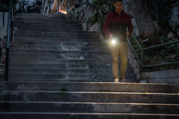 Fenix E08R UE EDC Flashlight used to navigate stairs at night