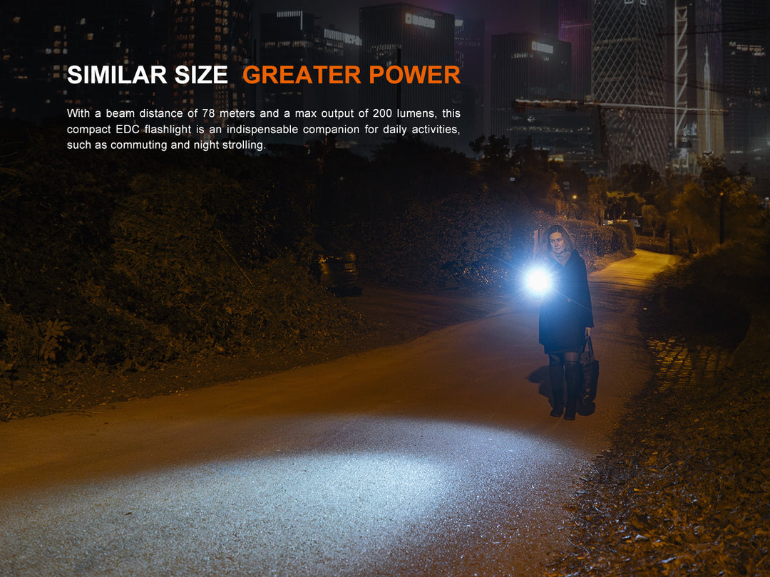 Fenix E12 V3 EDC flashlight used to walk a side street at night in the city