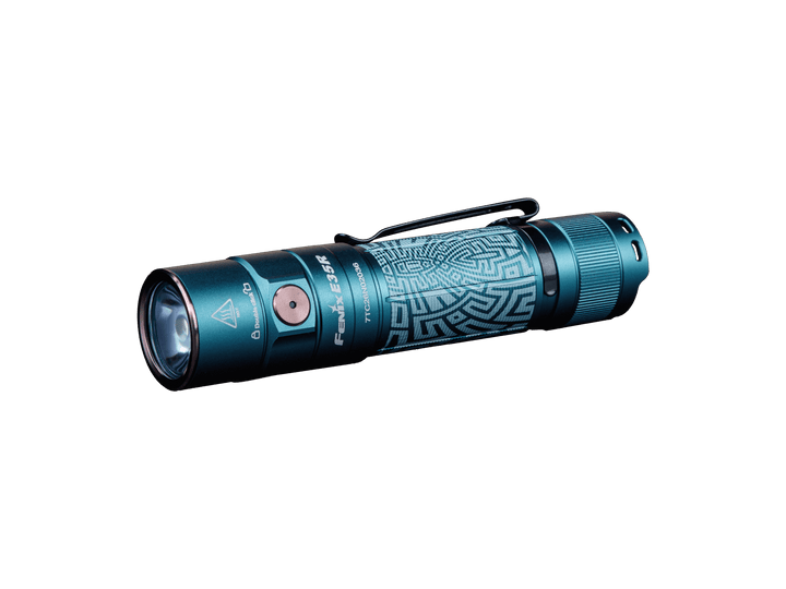 Blue Fenix E35R high-performance rechargeable LED flashlight with intricate design on a black background