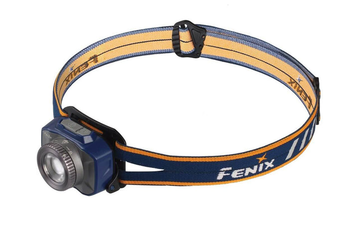 A blue Fenix HL40R focusable USB rechargeable LED headlamp with an orange and black adjustable headband.