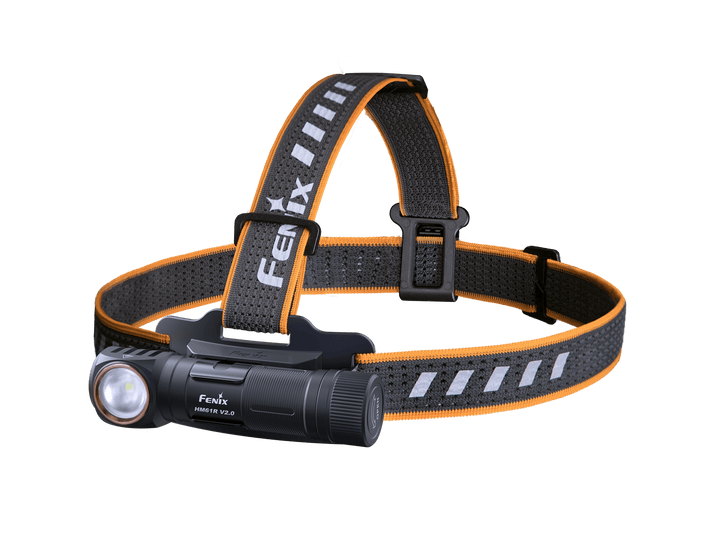 A black Fenix HM61R V2 rechargeable LED headlamp with an adjustable strap featuring orange and white accents.