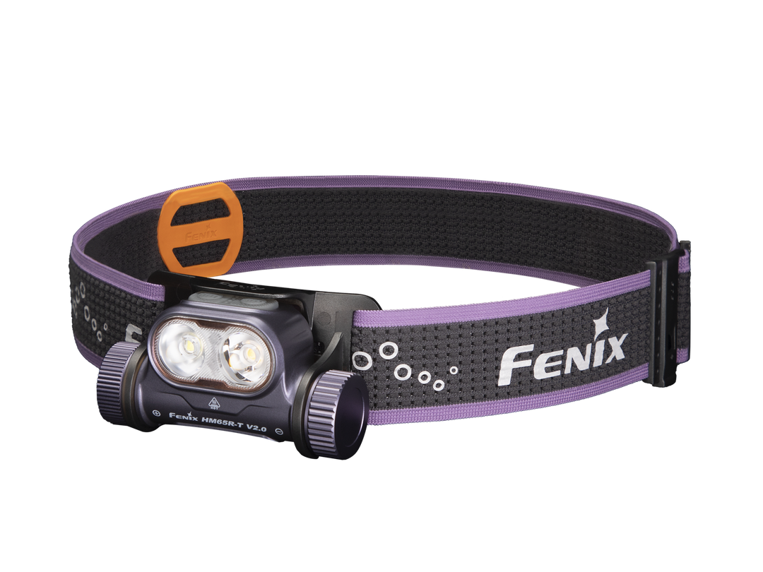 A lightweight Fenix HM65R-T V2 rechargeable trail running headlamp with a purple headband, black body, and LED lights, displayed against a white background.