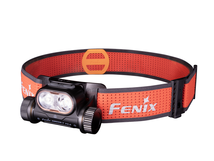 A black Fenix HM65R-T V2 rechargeable lightweight trail running headlamp with an orange adjustable headband.