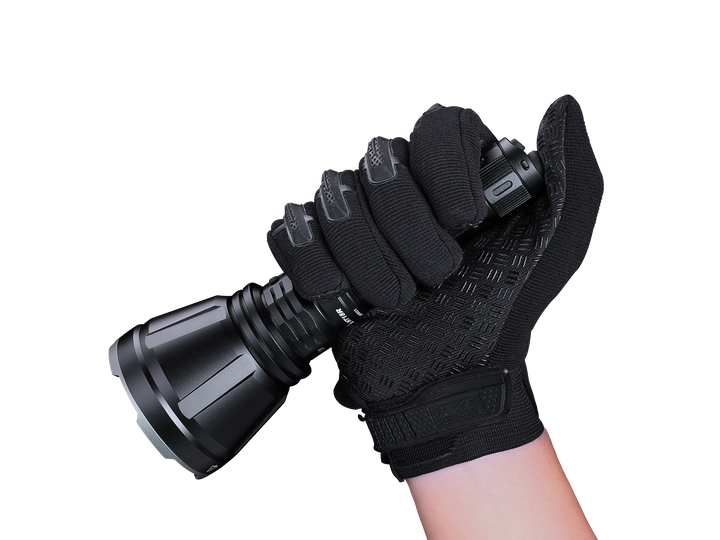 Fenix HT18R rechargeable hunting light held in a thumb grip
