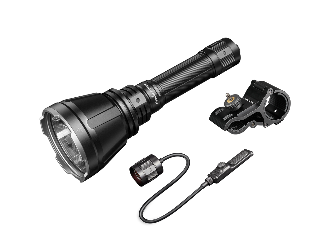 A Fenix HT18R rechargeable hunting light kit with accessories, including a mount and remote switch, displayed against a white background.