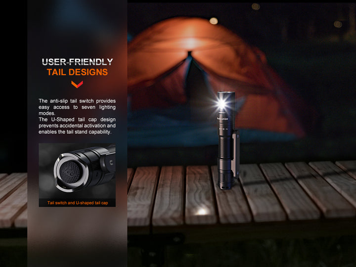 Fenix LD12R dual light flashlight standing on its tail on a dock
