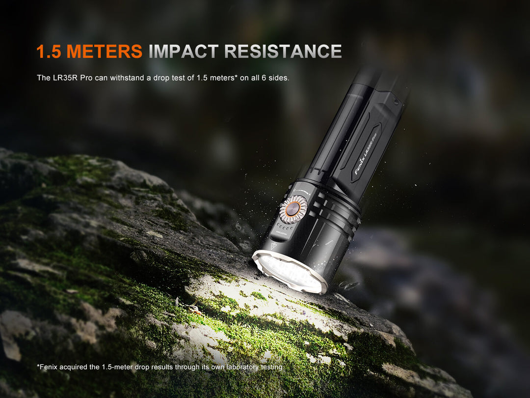 Black Fenix LR35R Pro Searchlight on a rock with text about impact resistance