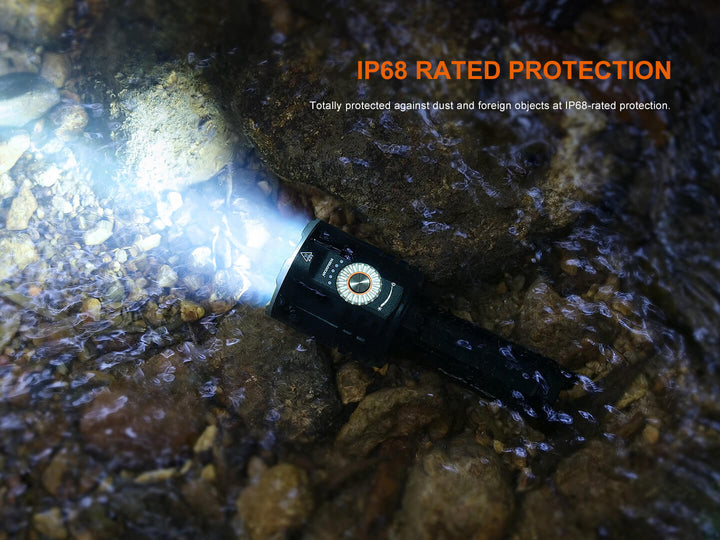Fenix LR35R Pro Searchlight underwater with IP68 rating text on a rocky surface