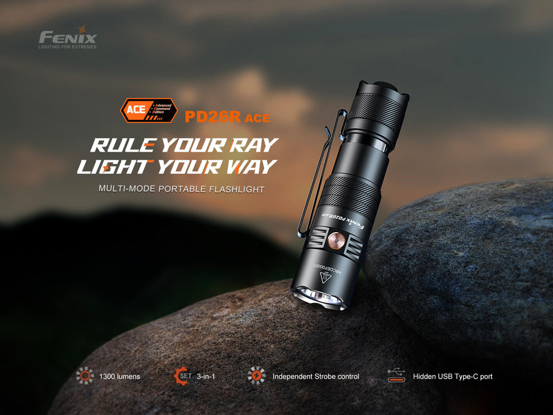 Fenix PD26R ACE flashlight on a rock with a dark background