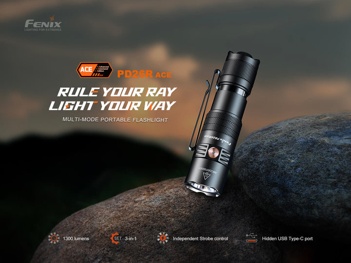 Fenix PD26R ACE flashlight on a rock with a dark background