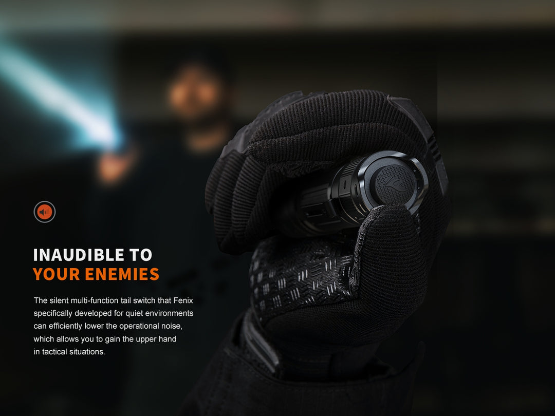 Fenix PD32R Flashlight held in a reverse grip showing the silent tail switch