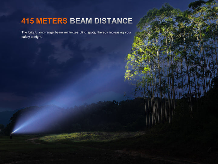 Fenix PD36R ACE flashlight beam distance demonstration with trees in the background