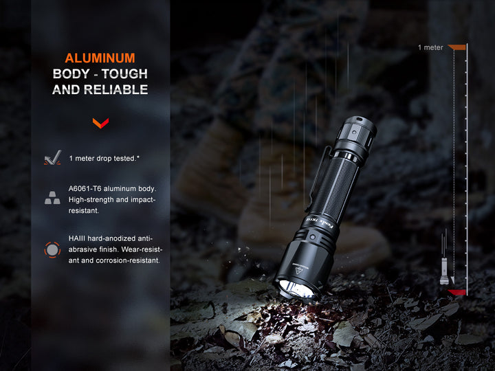 Fenix TK11R compact tactical flashlight dropped on stone