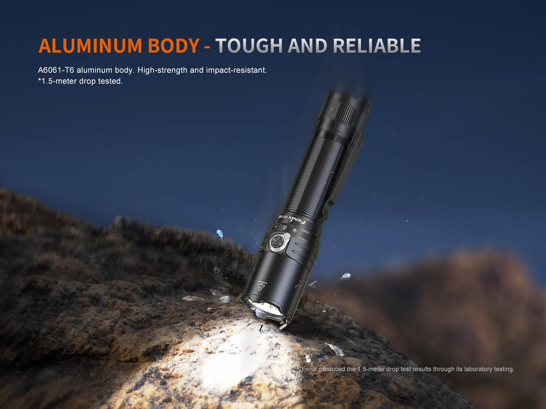 Black Fenix TK15R adaptive flashlight on a rock with text about its aluminum body being tough and reliable.