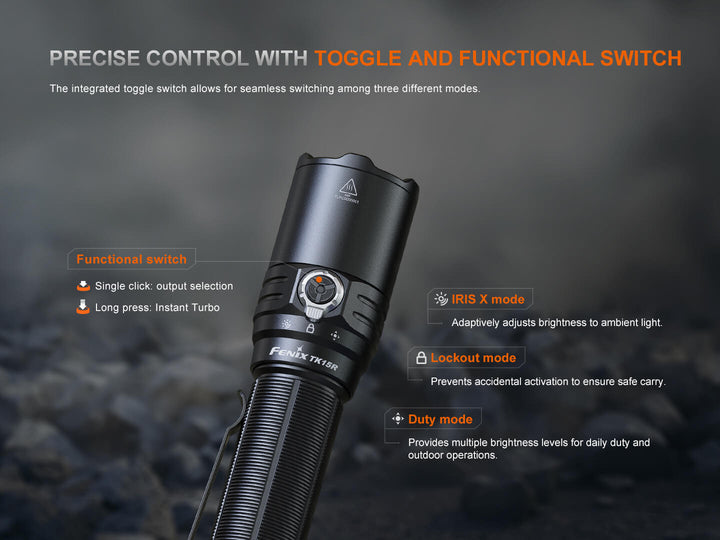 Black Fenix TK15R adaptive flashlight with toggle switch on a dark background