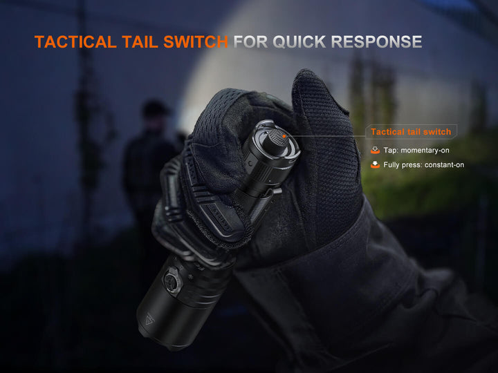 The tactical tail switch of the Fenix TK15R adaptive flashlight on a gloved hand with a dark background
