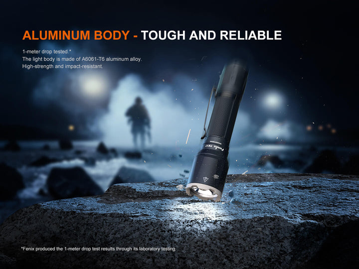Fenix TK17 Tactical Flashlight dropped onto stone