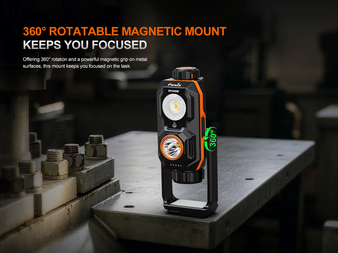 Fenix WT26RM work light attached to the edge of a steel workbench by its 360-degree rotatable magnetic mount