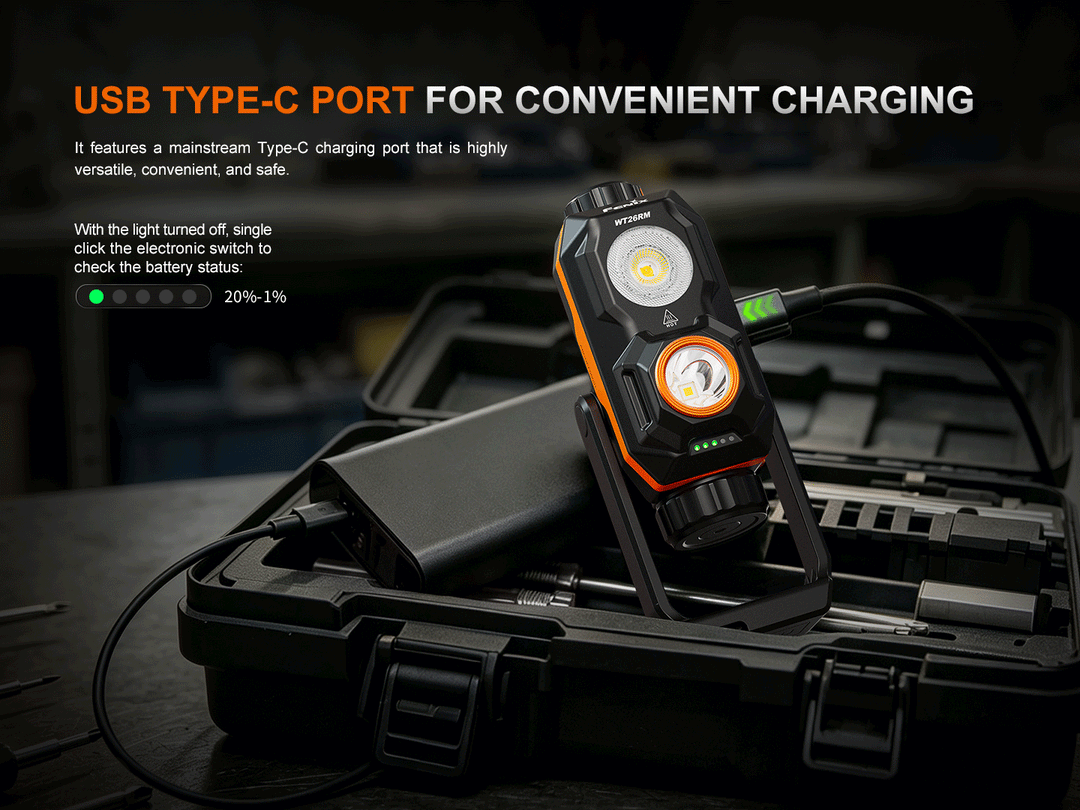 Fenix WT26RM connected to a USB Type-C charging cable and power bank inside an open tool case, with the battery level indicator lights shown
