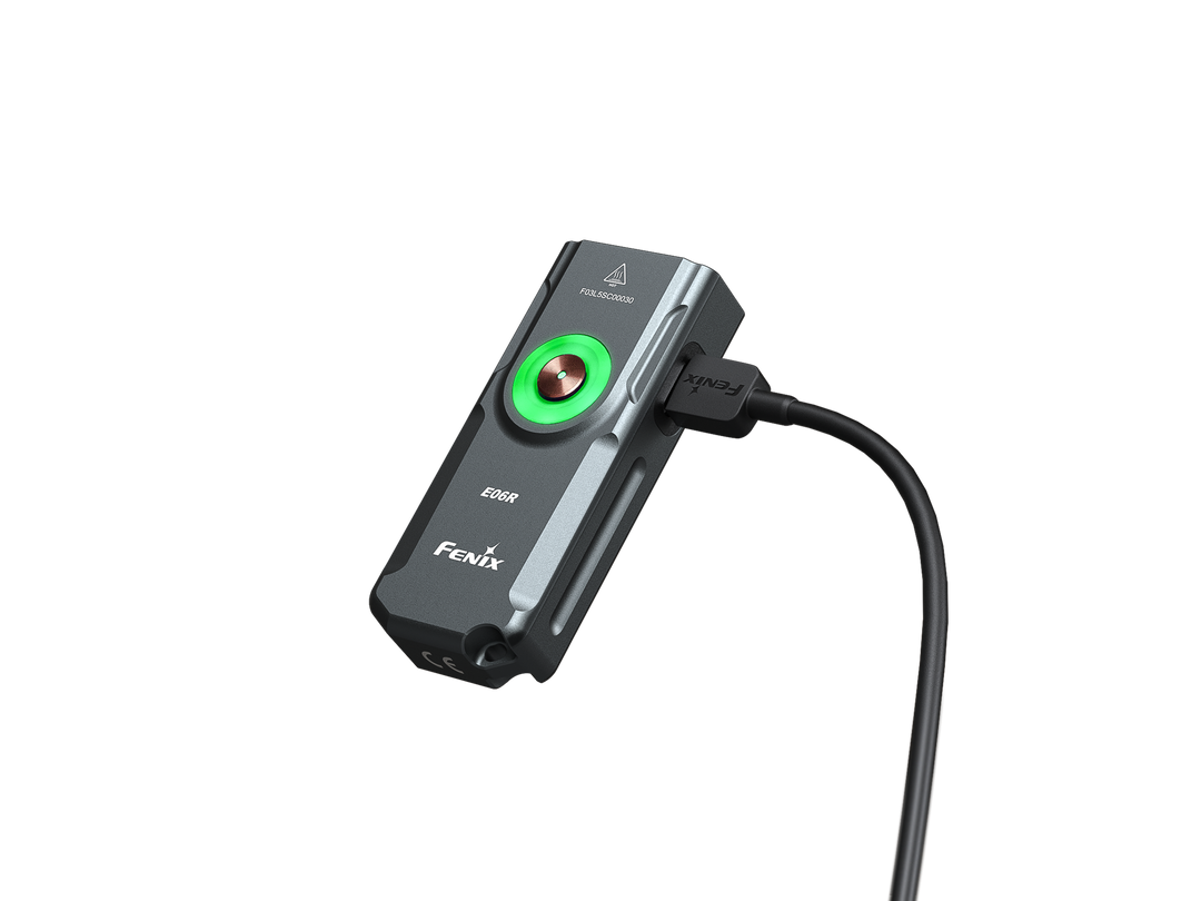 Fenix e06r keychain light in black plugged in to charge
