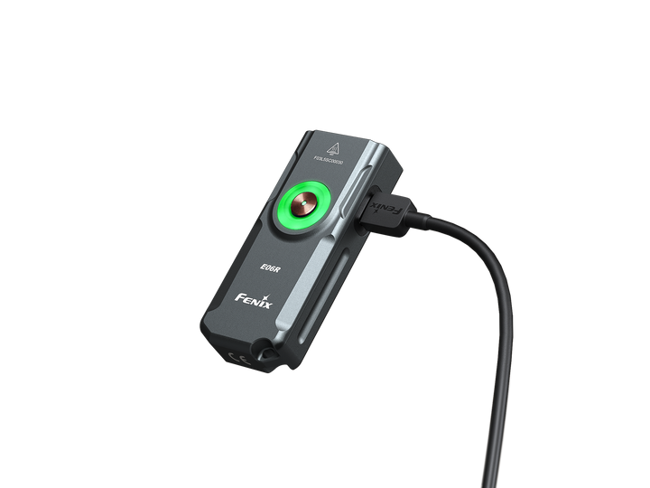 Fenix e06r keychain light in black plugged in to charge
