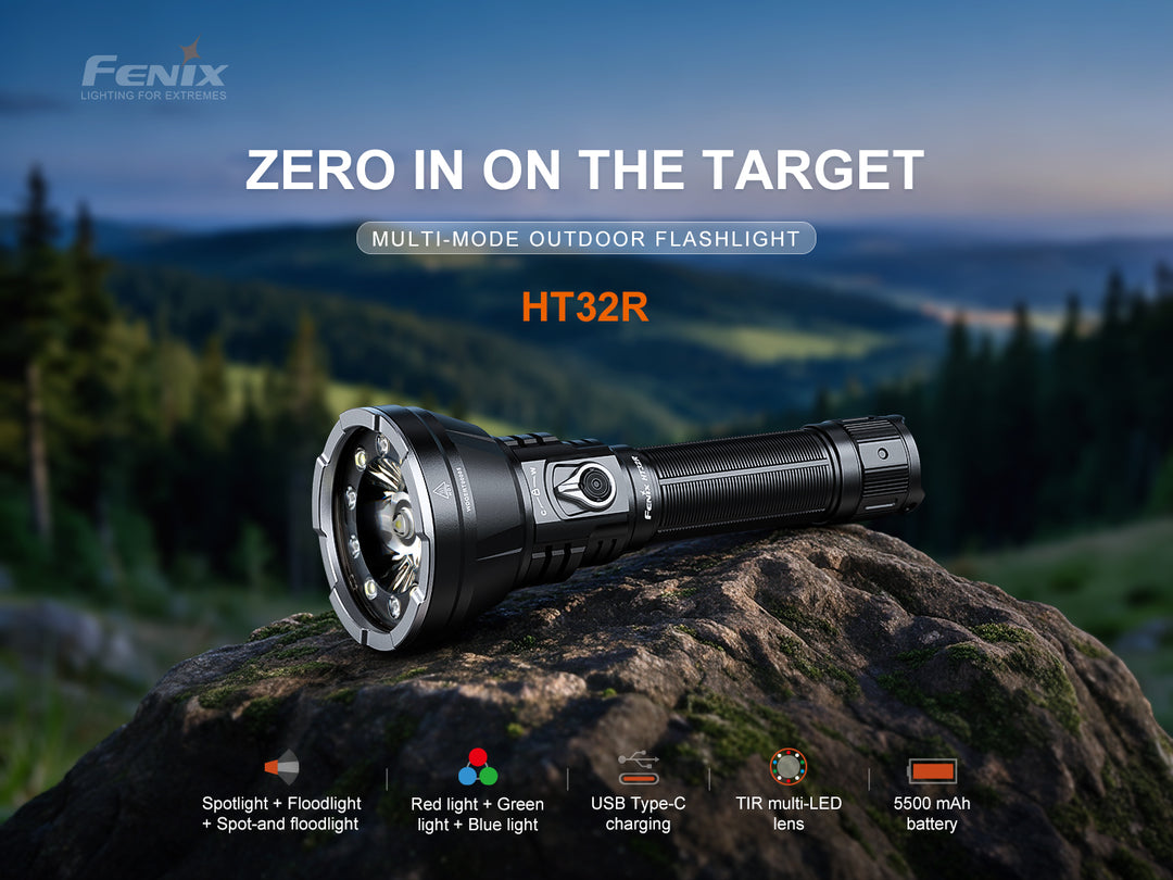 Fenix HT32R multi-mode outdoor flashlight on a rock at dusk, with icons for spotlight and floodlight, red green and blue light, USB-C charging, TIR multi-LED lens and 5500 mAh battery