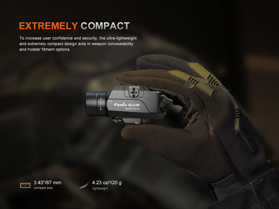 Fenix GL23R green laser tactical light held in a gloved hand