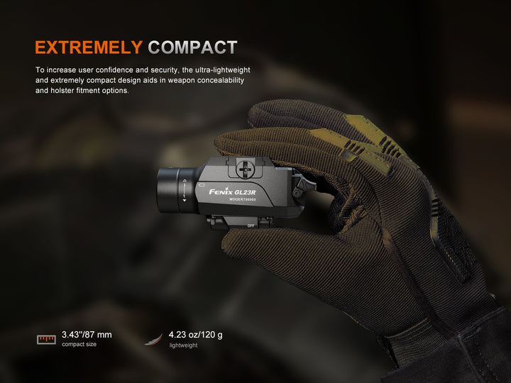 Fenix GL23R green laser tactical light held in a gloved hand