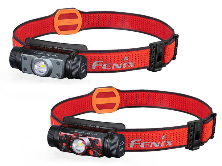 Two Fenix HM62-T lightweight trail running headlamps with red straps and black magnesium bodies.