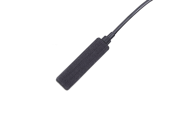 The backside of the Fenix AER-05 remote pressure switch with velcro attachment