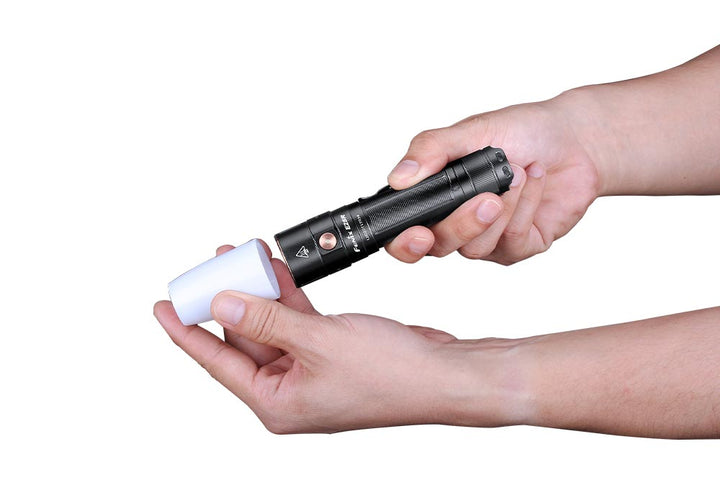 Fenix AOD-S V2 Diffuser held in hands being attached to a flashlight