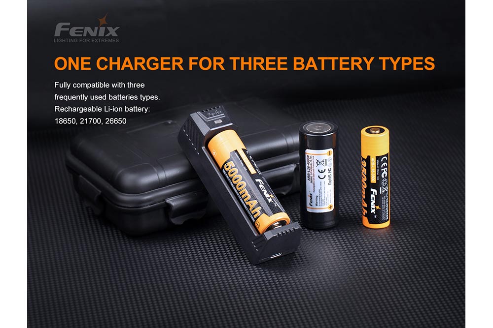 Fenix ARE-X1 V2 battery charger on black surface with several different battery types