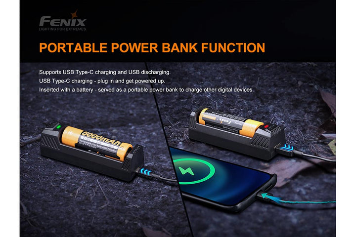 Fenix ARE-X1 V2 battery charger on black surface being used to charge a cell phone