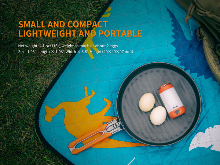 Fenix CL26R camping lantern on a pan next to eggs in order to show its small size