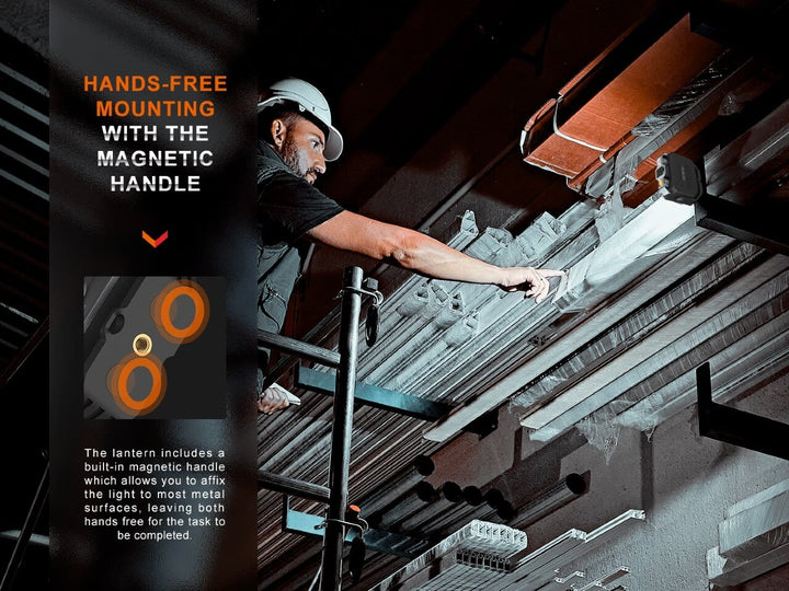 An industrial working using the magnetic base of the Fenix CL28R multifunctional outdoor lantern to work on metal scaffolding