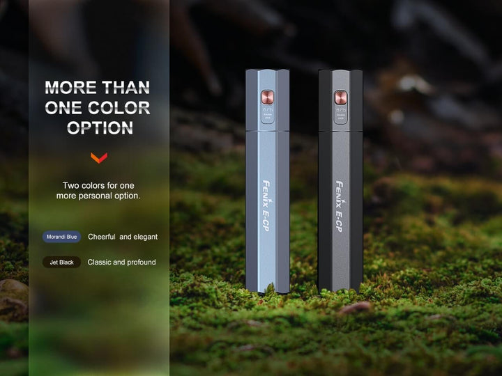 Fenix E-CP Powerbank Flashlight in black and blue sitting on a mossy surface