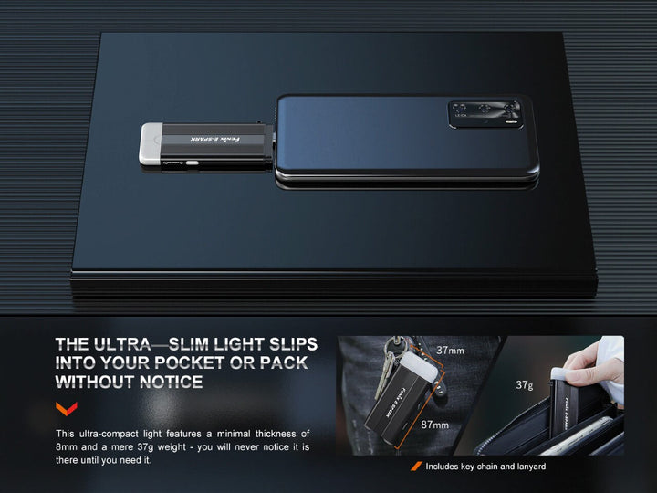 Fenix E-SPARK thin powerbank flashlight plugged into a phone while sitting on a lapatop